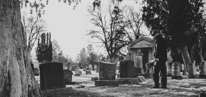 A man visits a grave site wondering about the probate process in Wisconsin