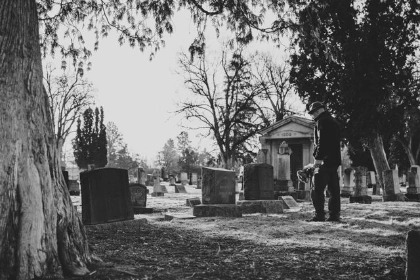 A man visits a grave site wondering about the probate process in Wisconsin